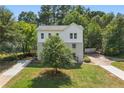 Two-story home with a well-maintained lawn and mature trees at 1583 Columbia Cir, Decatur, GA 30032