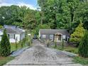 Charming single-story home with well-maintained landscaping and long driveway with ample parking at 2077 Brockett Rd, Tucker, GA 30084