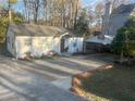 Cozy bungalow with covered parking and ample driveway space at 2077 Brockett Rd, Tucker, GA 30084