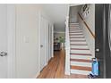 Bright foyer with hardwood floors and staircase leading to the upper level at 544 Stratford Grn, Avondale Estates, GA 30002