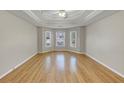 A spacious main bedroom with a decorative trey ceiling, recessed lighting, and ample natural light at 742 Wilkes Dr, Loganville, GA 30052