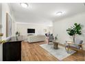 Inviting living area with wood floors, contemporary decor, and an open layout leading to dining area at 1111 Clairemont Ave # P5, Decatur, GA 30030