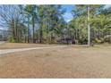 Expansive front yard with a long driveway leading to a well-maintained, brick home at 1672 Zemory Dr, Tucker, GA 30084