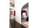 Bright foyer with archways leading to dining, hardwood floors, and views of the upper level at 15 Blanket Pass, Covington, GA 30016