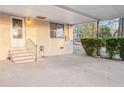 Large carport with steps leading to the house, offering ample covered parking and storage space at 1729 Norden Rd, Riverdale, GA 30296