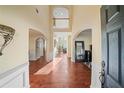 Grand foyer featuring soaring ceilings, hardwood floors, and elegant archways, creating a luxurious entrance at 3125 Crooked Stick Dr, Cumming, GA 30041