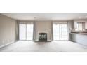 Bright living room featuring a fireplace, sliding doors to the balcony, and an open layout at 14 Muncy Se Ct, Smyrna, GA 30080