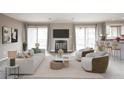 Tastefully furnished living area with fireplace, balcony access, and an open flow to the modern kitchen at 14 Muncy Se Ct, Smyrna, GA 30080