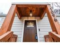 Close-up of the house entrance showing the wood porch details and a stylish front door at 1096 Ferndale St, Stone Mountain, GA 30083