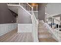 Inviting foyer featuring hardwood floors, staircase, and decorative wall trim at 504 Trotters Ln, Mcdonough, GA 30252