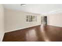 Spacious living room featuring hardwood floors and a large window for natural light at 793 Parkway Se Dr, Smyrna, GA 30080