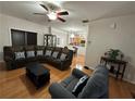 Spacious living room featuring hardwood floors, a comfortable sectional sofa, and an open layout at 3513 Kensington Parc Cir, Avondale Estates, GA 30002