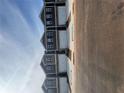 Row of modern townhomes featuring neutral exteriors and attached garages at 11555 Kimberly Way # 19, Hampton, GA 30228
