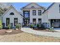 Beautiful two-story home showcases black trim, elegant architecture, and landscaped front yard at 1046 Sterling Ridge, Marietta, GA 30062