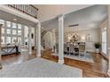 Open-concept living area features soaring ceilings, large windows, and a cozy fireplace at 1046 Sterling Ridge, Marietta, GA 30062