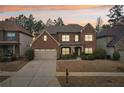 This beautiful brick house boasts professional landscaping and a two-car garage at 2126 Roberts View Trl, Buford, GA 30519