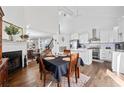 Open-concept kitchen features stainless appliances, island, and hardwood floors with adjoining dining area at 2826 Cobb Place Manor Ct, Marietta, GA 30066
