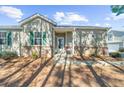Charming single-Gathering home with a well-maintained lawn and a covered front porch at 233 Hiawassee Dr, Woodstock, GA 30188