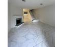 Bright living area with fireplace, tile floors, and staircase at 498 Prince Of Wales, Stone Mountain, GA 30083