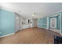 Open concept featuring living room, kitchen with white countertops, and access to exterior at 1321 Keys Lake Ne Dr, Brookhaven, GA 30319