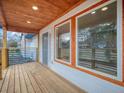 Inviting front porch with wood ceiling, pillars and a view of the neighborhood at 2195 Burroughs Ave, Atlanta, GA 30315