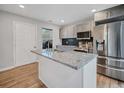 Modern kitchen featuring stainless steel appliances, granite countertops, and a functional island at 2195 Burroughs Ave, Atlanta, GA 30315