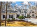 Beautiful home with neutral color scheme, dark shutters, and beautiful landscaping at 285 Blackstock Rd, Villa Rica, GA 30180