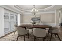 Formal dining room with stylish chandelier, trim detail, and natural light at 160 Antler Trl, Alpharetta, GA 30005