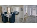 Inviting dining room with modern table, chairs, decor, and plenty of natural light at 3677 Rosebud Park Dr, Snellville, GA 30039