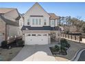 Charming two-story home with a two-car garage and manicured lawn at 550 Onyx Lndg, Marietta, GA 30064