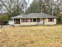 Charming single-Gathering home showcases its well-kept front lawn and classic design in a peaceful neighborhood at 733 Linda Way, Forest Park, GA 30297