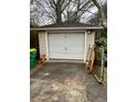A detached garage in neutral siding with a traditional door design at 733 Linda Way, Forest Park, GA 30297