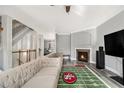 Inviting living room featuring a fireplace, neutral walls, and wood-look floors at 2722 Hallwood Ln, Suwanee, GA 30024