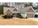 Inviting single-story home with manicured lawn, stone details, and convenient two-car garage at 28 Butler Park Ct, Dallas, GA 30157