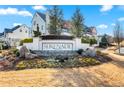Inviting community entrance with decorative landscaping, stone accents, and the 'Serenade' community sign at 714 Opera Ln, Alpharetta, GA 30009