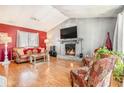 Inviting living room with vaulted ceilings, stone fireplace, and hardwood floors at 1040 Forest East Dr, Stone Mountain, GA 30088