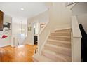 Inviting home foyer featuring hardwood floors, staircase, and neutral paint, creating a warm welcome at 1532 Oak Grove Rd, Decatur, GA 30033