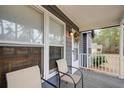 Inviting front porch features seating and a view into the home, accentuating a cozy ambiance at 335 Old Airport Rd, Carrollton, GA 30116