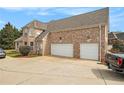 Spacious three-car garage and expansive driveway, offering ample parking and convenient access at 1132 Venetian Ln, Hampton, GA 30228