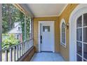 Inviting screened porch with white railing and view of the neighborhood at 1247 Monroe Ne Dr, Atlanta, GA 30306