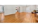 Inviting living room with beautiful hardwood floors seamlessly connecting to kitchen at 3087 Meadow Lark Ln, East Point, GA 30344