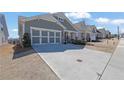 Charming home with a two-car garage, neutral paint, and concrete driveway, with a landscaped yard at 814 Spruce Ave, Canton, GA 30114