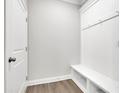 Bright mudroom offers a convenient bench and coat hooks, perfect for storage and organization at 814 Spruce Ave, Canton, GA 30114