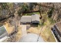 An aerial view of a well-maintained home, fenced backyard and circular driveway at 2690 Manassas Pl, Snellville, GA 30039