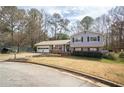 Charming two-story home featuring a well-maintained front yard with established landscaping at 2690 Manassas Pl, Snellville, GA 30039