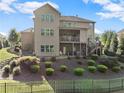Spacious backyard featuring a patio, deck, lush landscaping, and a fence for added privacy at 4070 Preserve Crossing Ln, Cumming, GA 30040