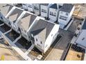 Aerial view of new construction homes showcasing modern design and well-maintained landscaping in a desirable neighborhood at 481 Hammons Way, Atlanta, GA 30315