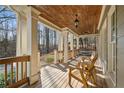 Inviting covered porch with a stained wood ceiling and comfortable seating at 351 Allendale Dr, Canton, GA 30115
