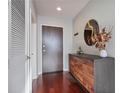 Modern hallway with a decorative mirror, console table, and stylish accents at 855 Peachtree Ne St # 2801, Atlanta, GA 30308