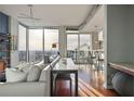 Cozy living room with city views, hardwood floors, and modern decor at 855 Peachtree Ne St # 2801, Atlanta, GA 30308